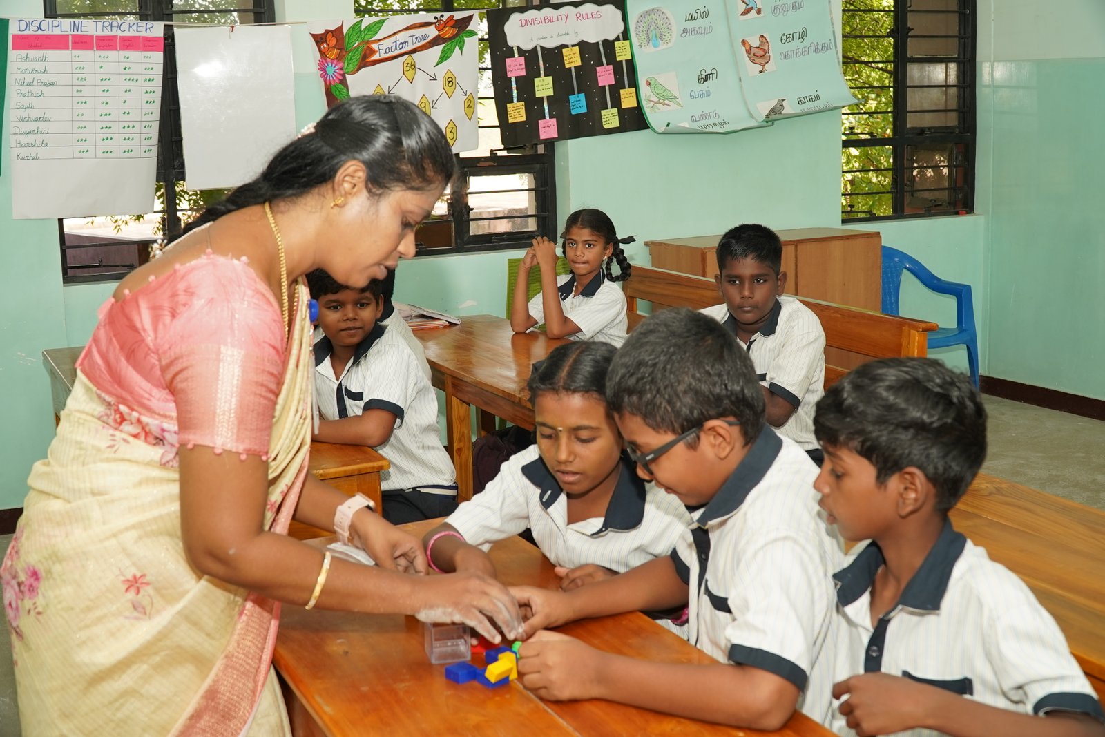 Teacher guiding students during outdoor learning